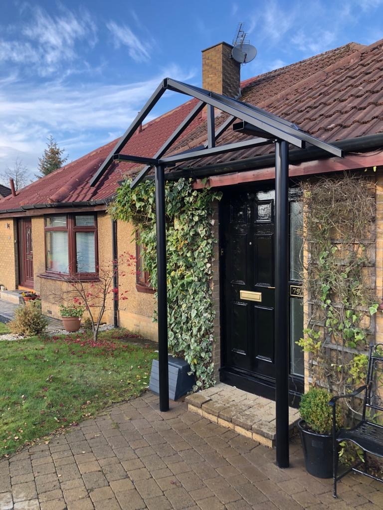A house of yellow color withred tiles