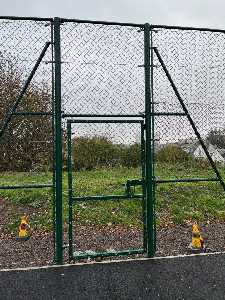 A green fate with railing