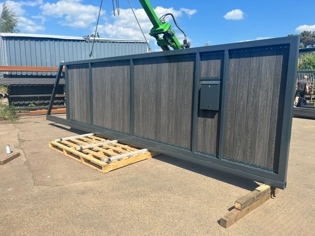 A blue gate with green machine