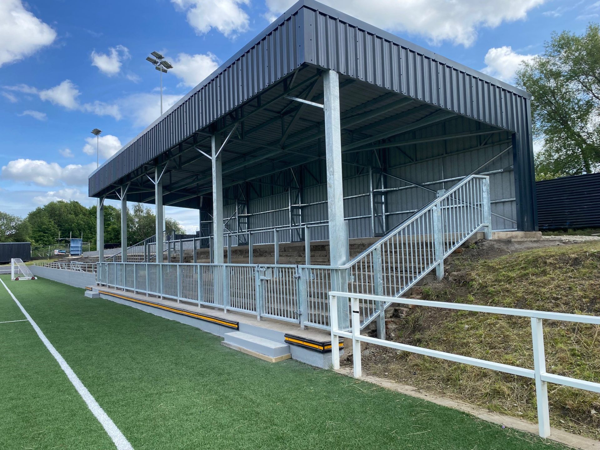 Sports stand at field edge